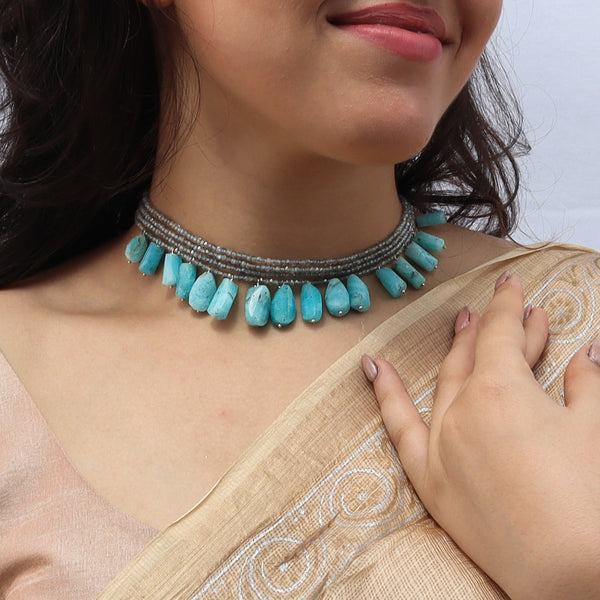 Model wearing Luxe Labradorite Larimar necklace with silver beads