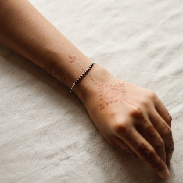 Silver mangalsutra bracelet chain detailing