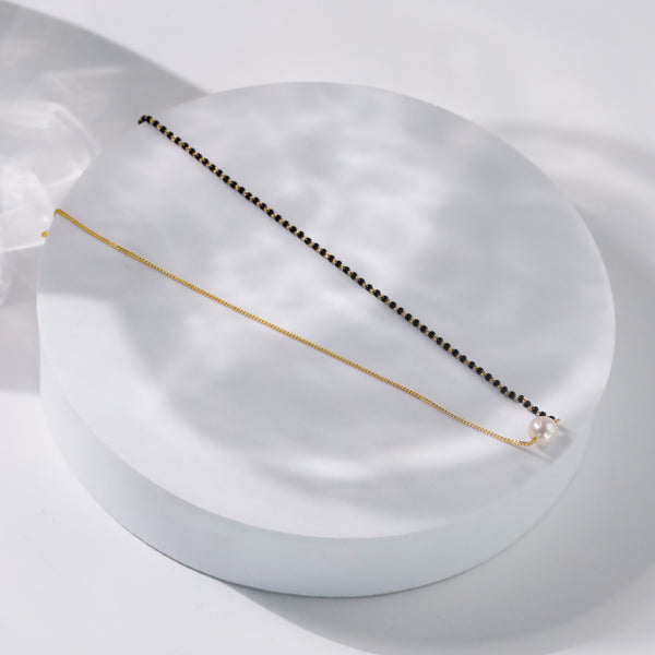 Gold and black pearl necklace