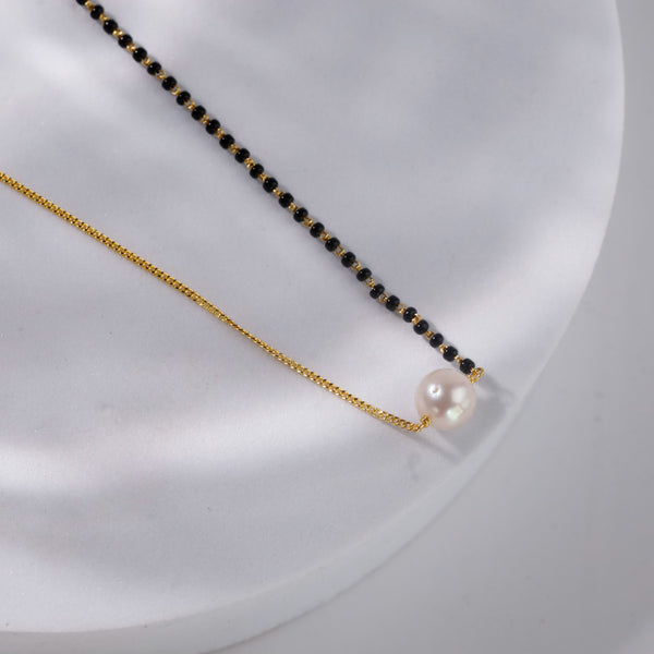 Pearl and black bead necklace with gold chain