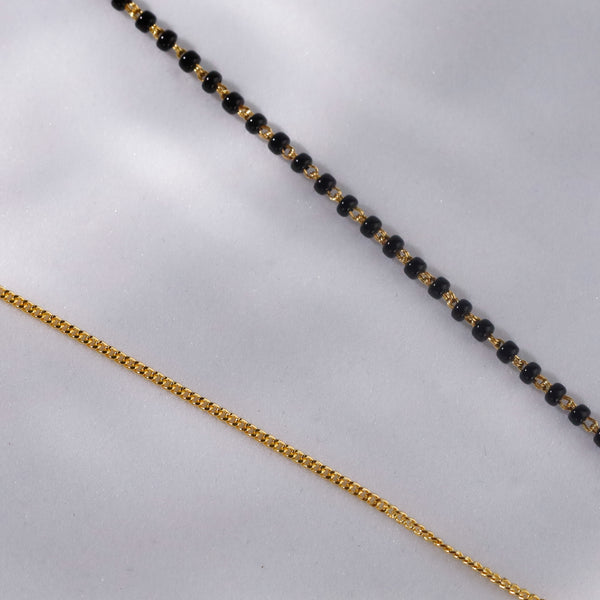 Gold chain with black beads