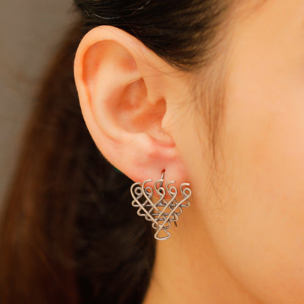 Small Saraswati motif silver earrings detailing