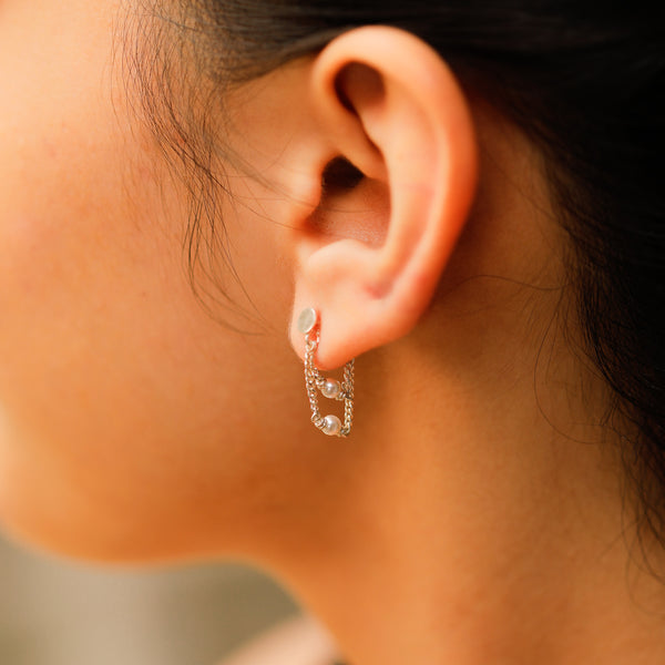 Layered pearl silver earrings detailing