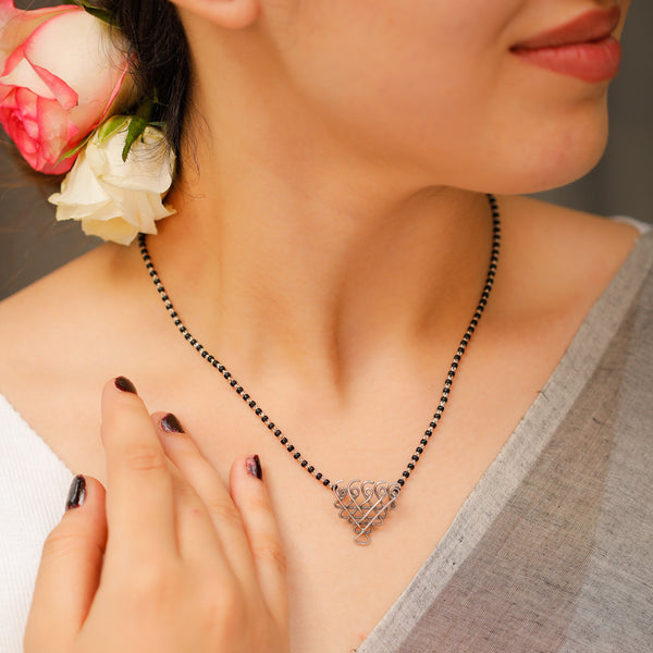 Small Saraswati motif silver mangalsutra detailing