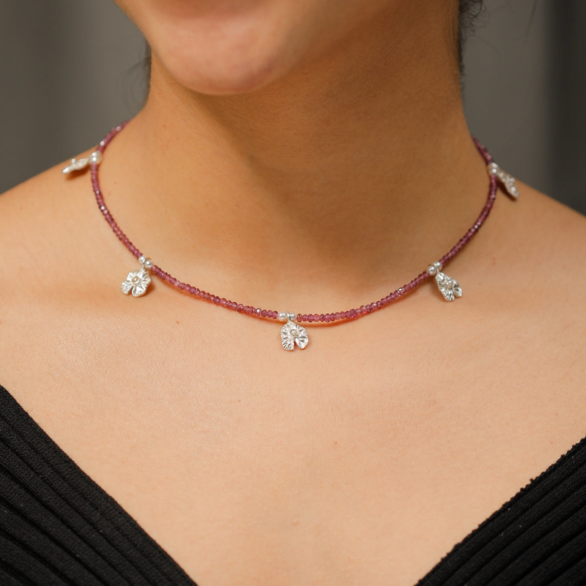 Silver Saroj Parn Multi Charm Necklace with Rhodolite