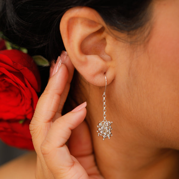 Silver bead cluster earrings close-up handcrafted detailing