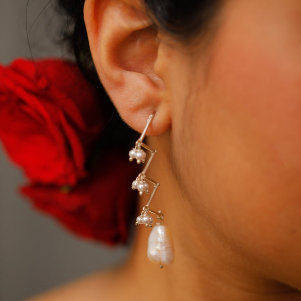 Model wearing Silver Pearl Zig-Zag Earrings with Pearl Drop