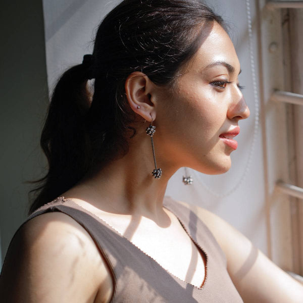 Silver dangler earrings with floral beadwork