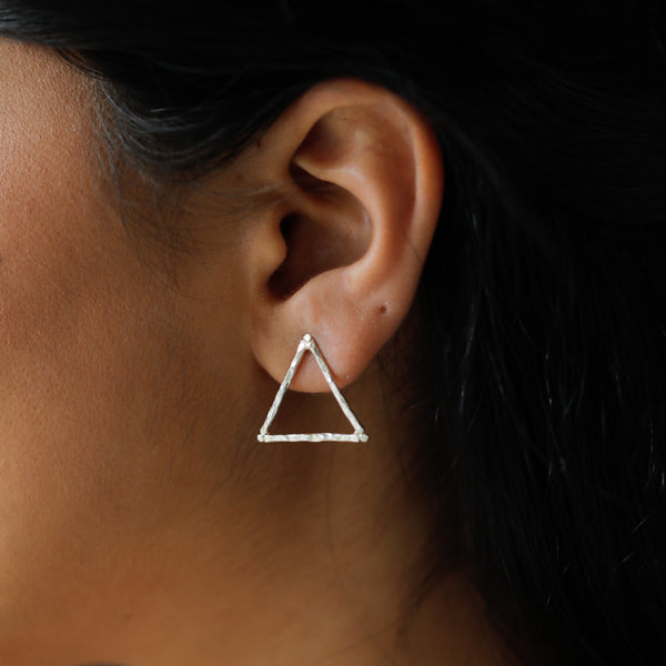 Hammered texture triangle silver earrings close-up detailing