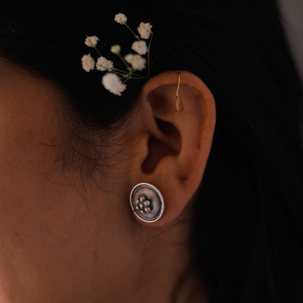 Maharashtrian kudi motif circle silver earrings close-up detailing