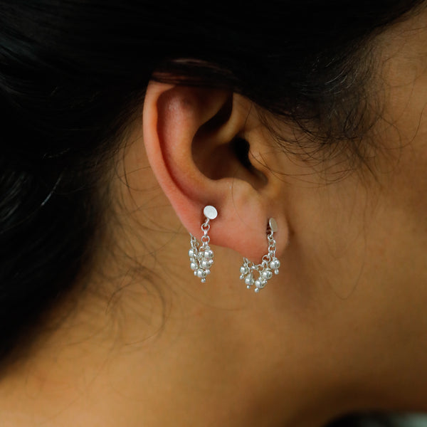 Silver Beads Trinket earrings on ear