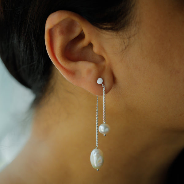 Elegant pearl drop earrings with cascading pearls on silver chain