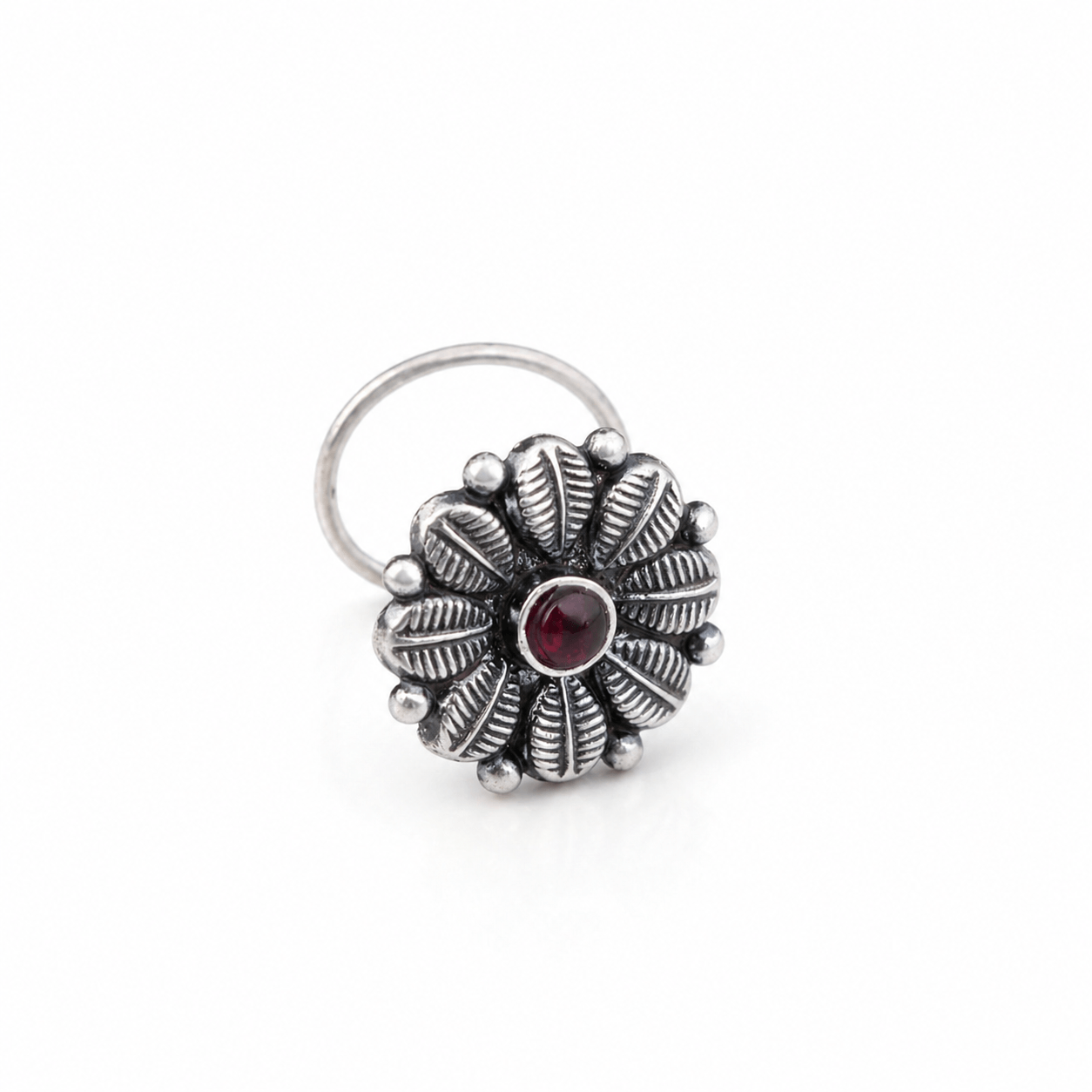 Silver Nose Pin with Red Stone, handcrafted in 92.5% sterling silver, featuring a floral design with a central red gemstone for elegant body jewelry.