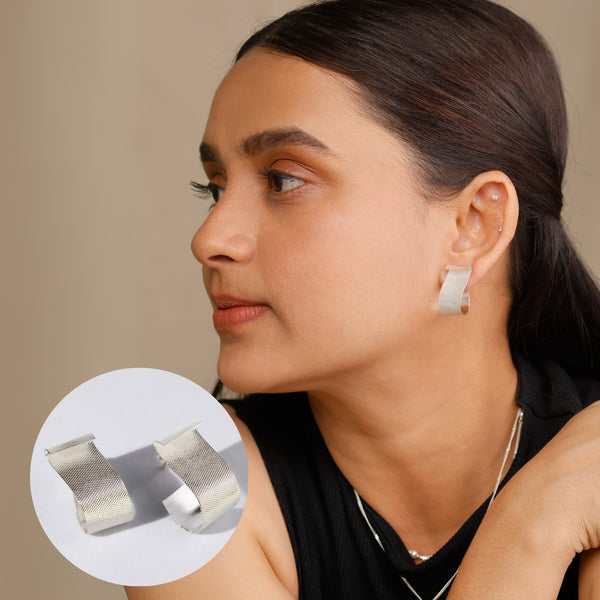 Silver fold earrings with sculptural shine