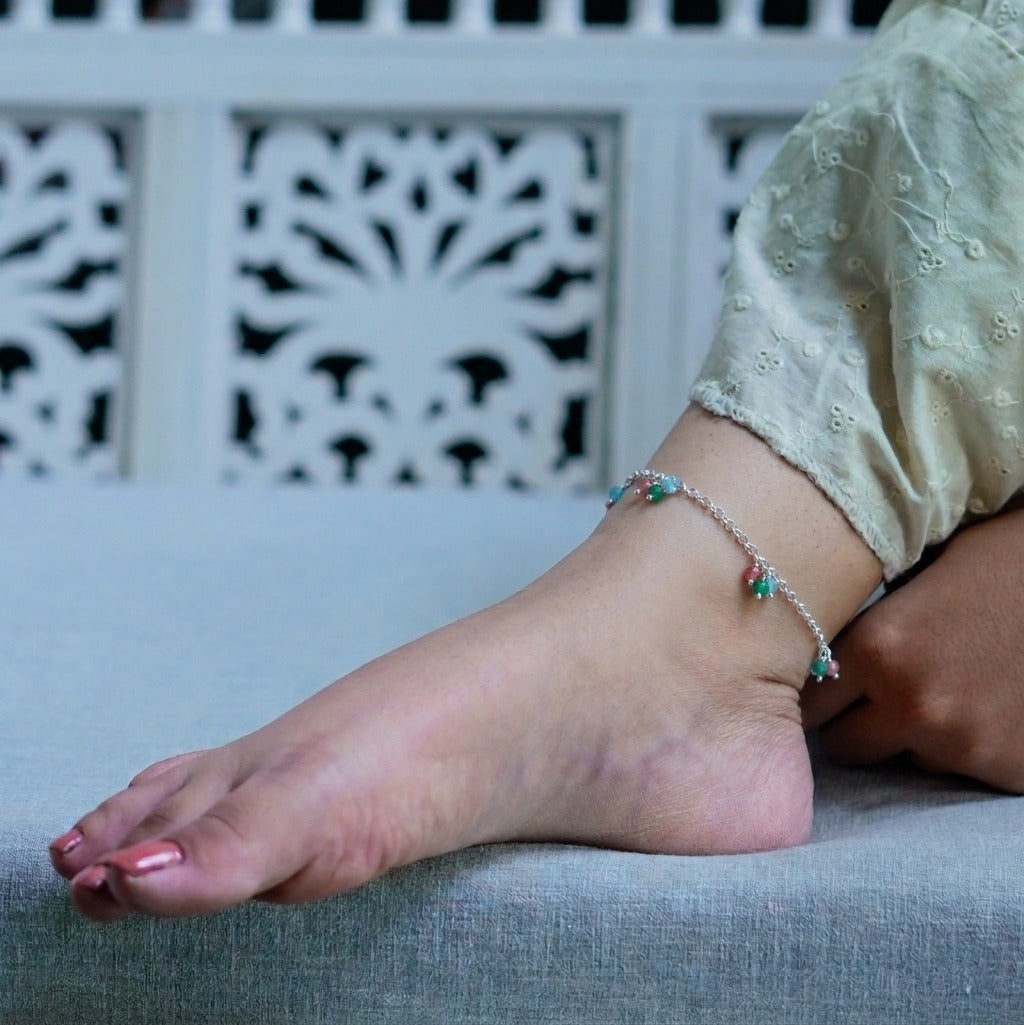 Woman wearing colorful beaded anklet on ankle