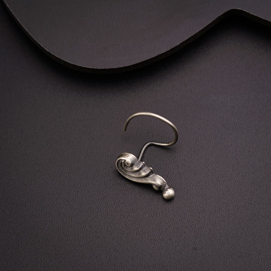 a pair of earrings sitting on top of a table