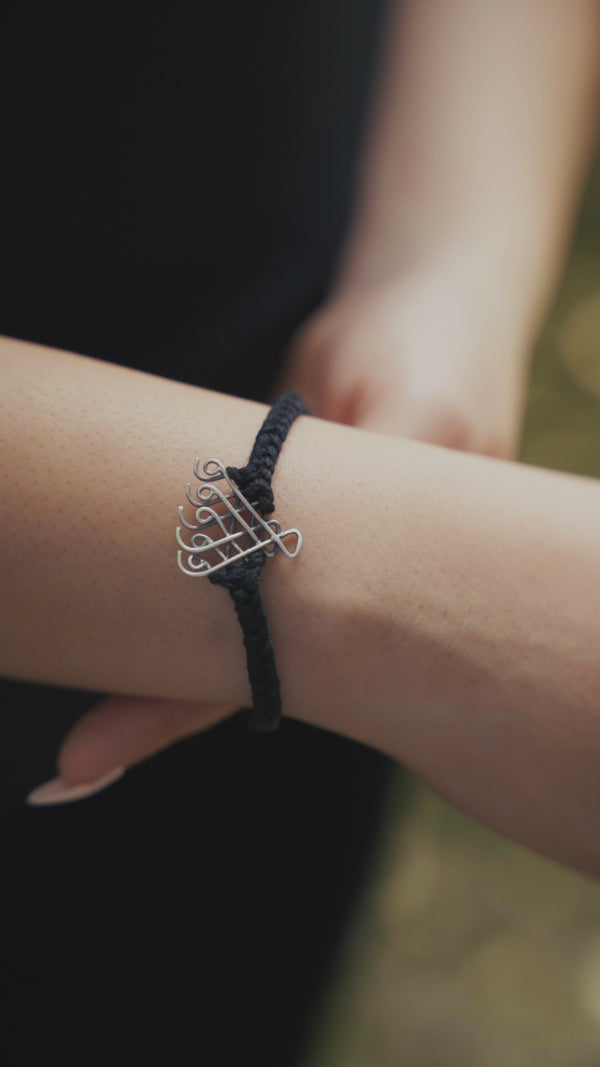 Handcrafted silver Saraswati bracelet black thread polished finish
