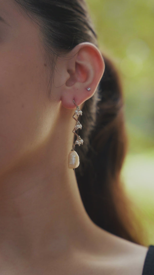 Close-up of Silver Pearl Zig-Zag Earrings with Pearl Drop