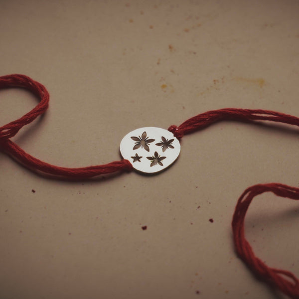 Silver Laser Cut Floral Rakhi