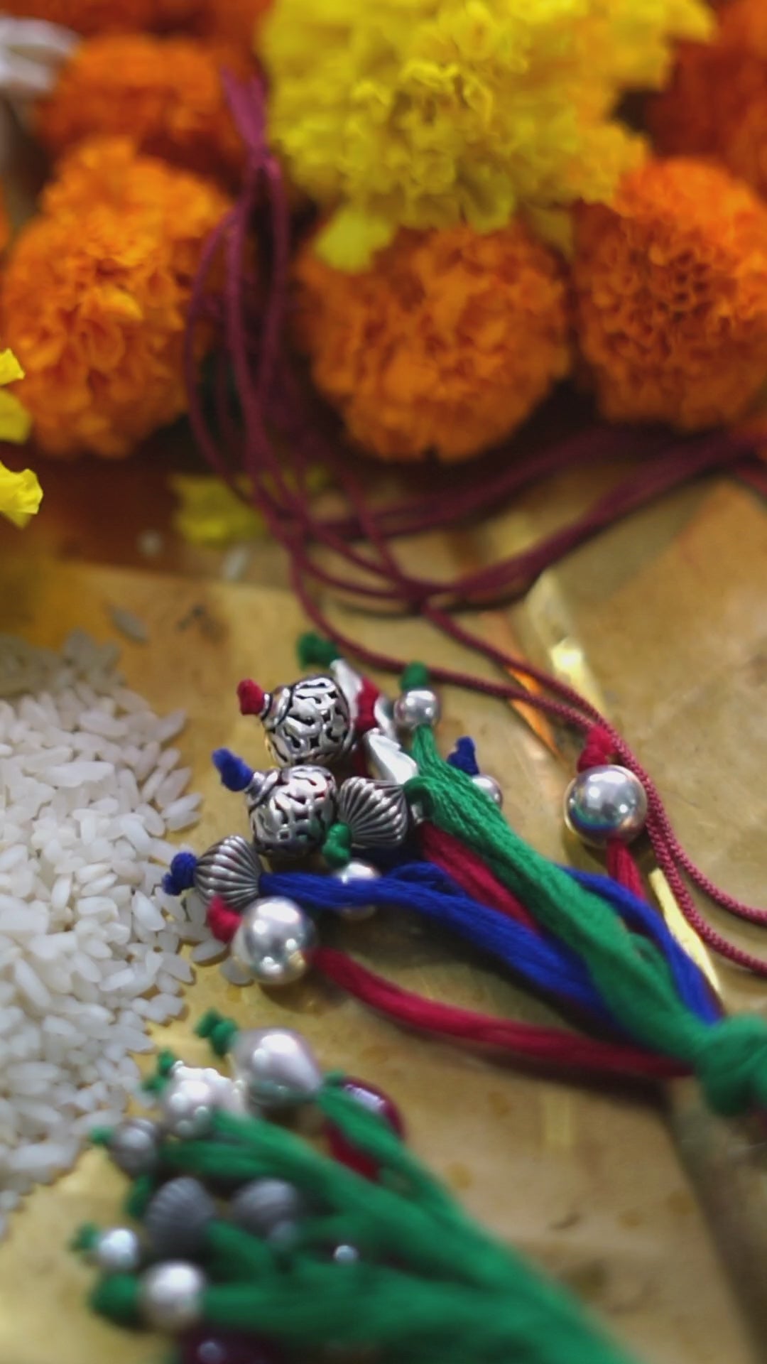 a bunch of beads and flowers on a table