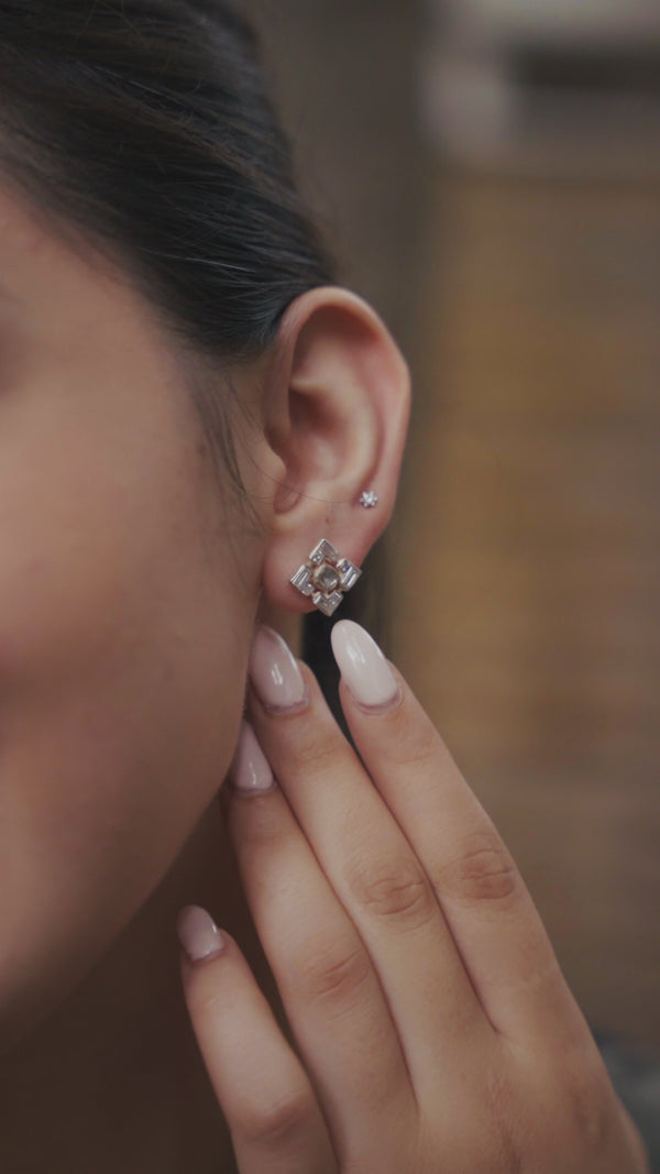 Close-up of woman wearing stylish earrings and necklace