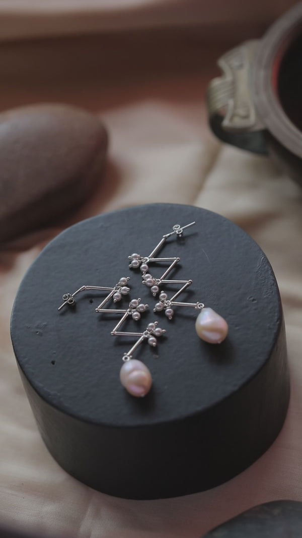 Unfinished Silver Pearl Zig-Zag Earrings with Pearl Drop on Black Surface