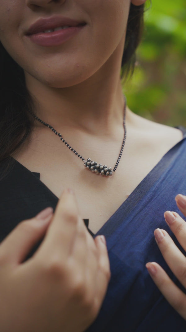Sterling silver necklace with black beads and ghungroo cluster