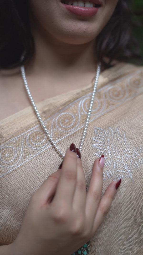 Model wearing Luxe Necklace with Larimar and Swarovski Pearls
