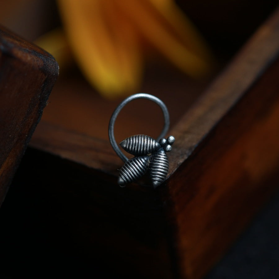 a metal ring sitting on top of a wooden table