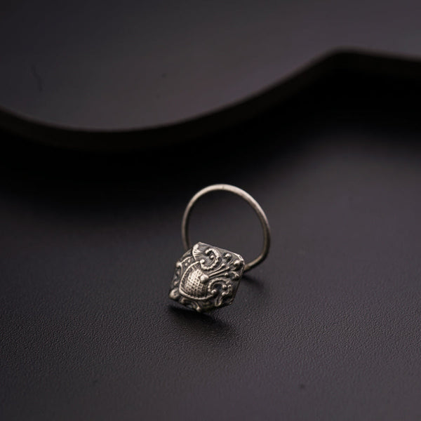 a close up of a ring on a black surface