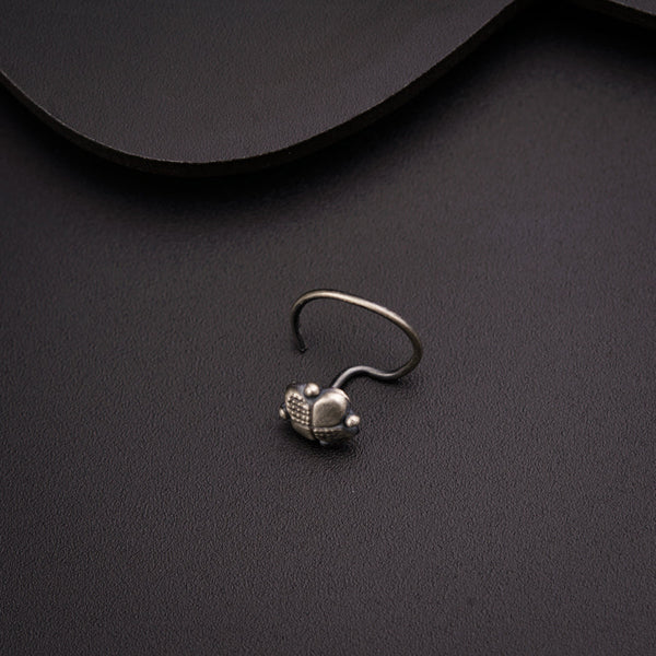 a silver ring with a skull on it