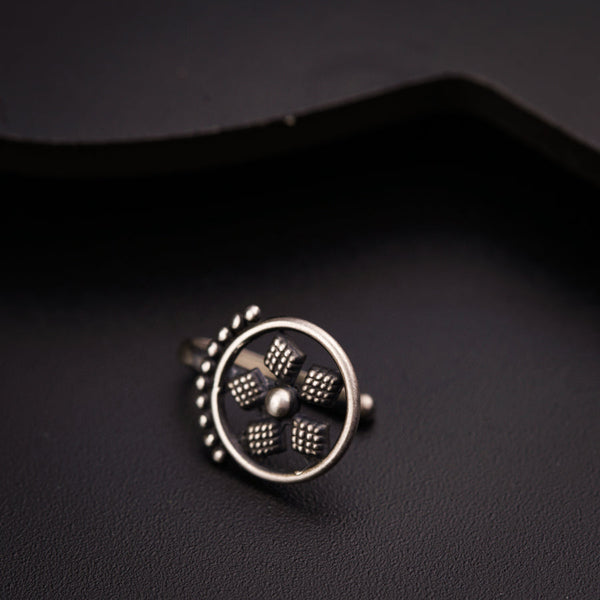 a close up of a ring on a black surface