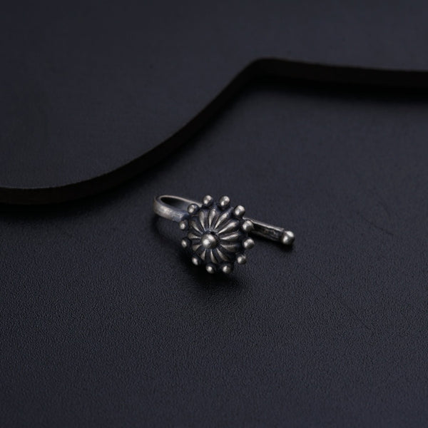 a close up of a ring on a black surface