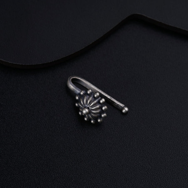 a pair of scissors sitting on top of a black surface