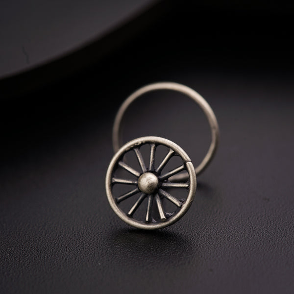 a close up of a ring on a black surface