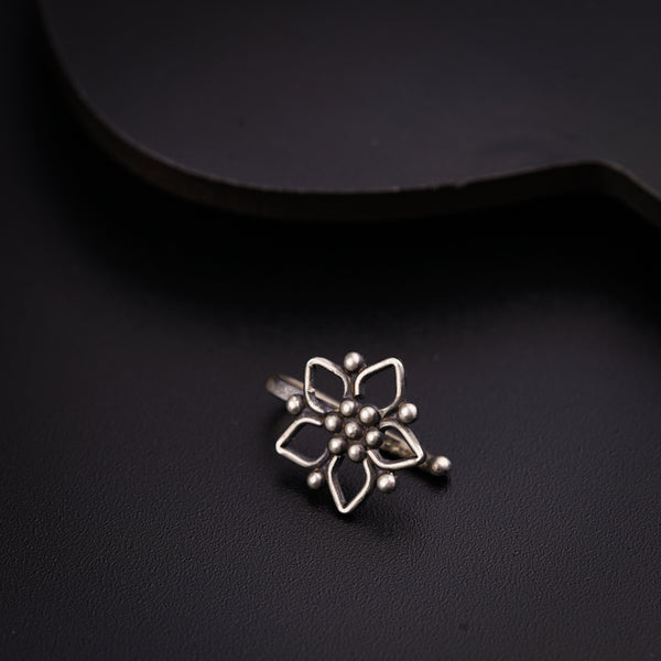 a close up of a ring on a black surface