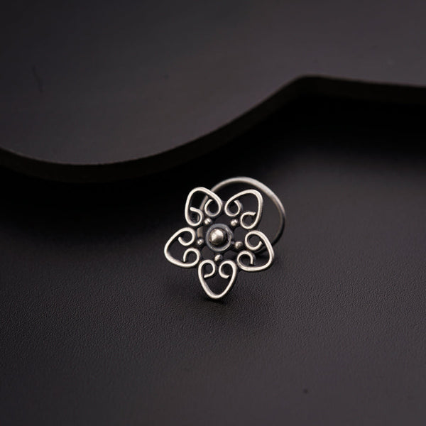a close up of a ring on a black surface