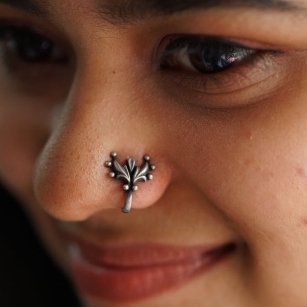 a close up of a person with a nose piercing