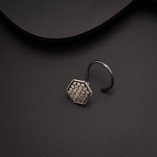 a close up of a ring on a black surface