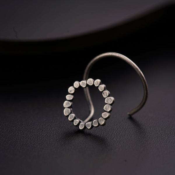 a close up of a ring on a black surface