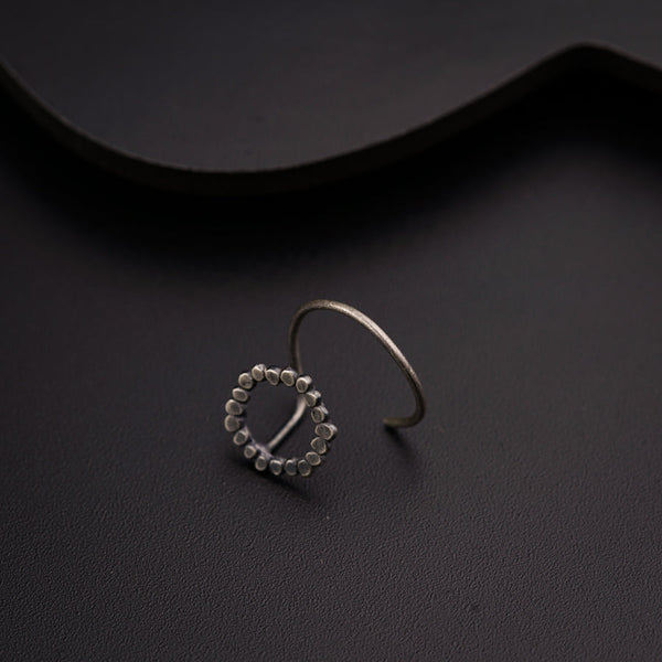 a pair of silver rings sitting on top of a table