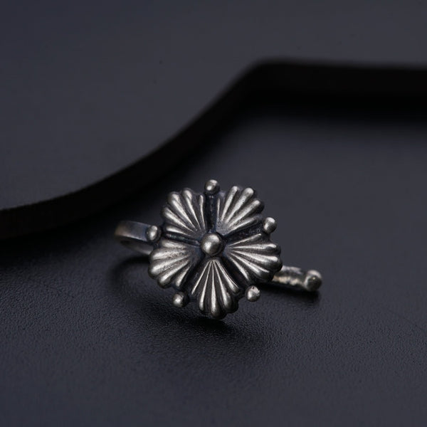 a close up of a ring on a black surface