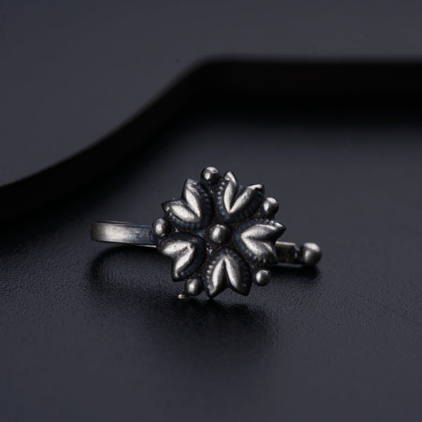 a close up of a ring on a black surface