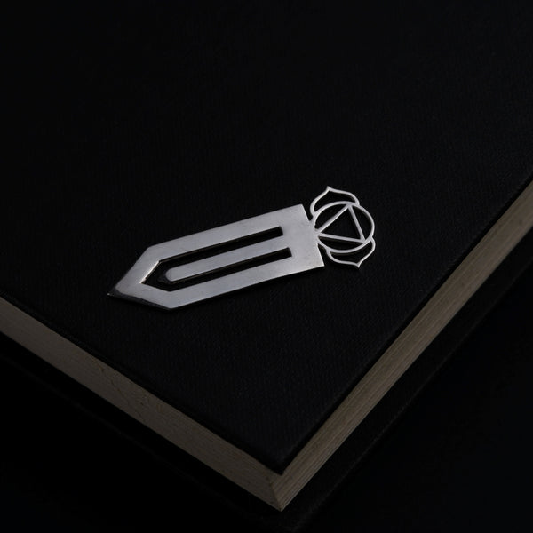 a book with a knife on top of it