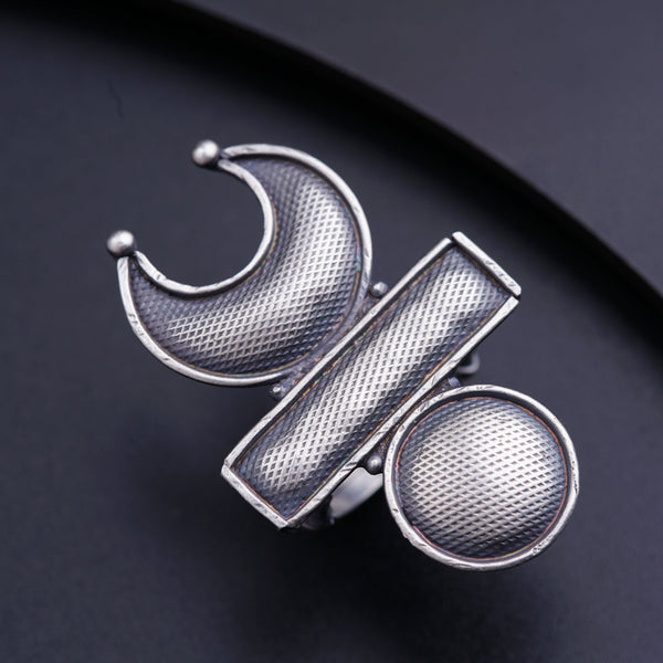 a close up of a ring on a black surface