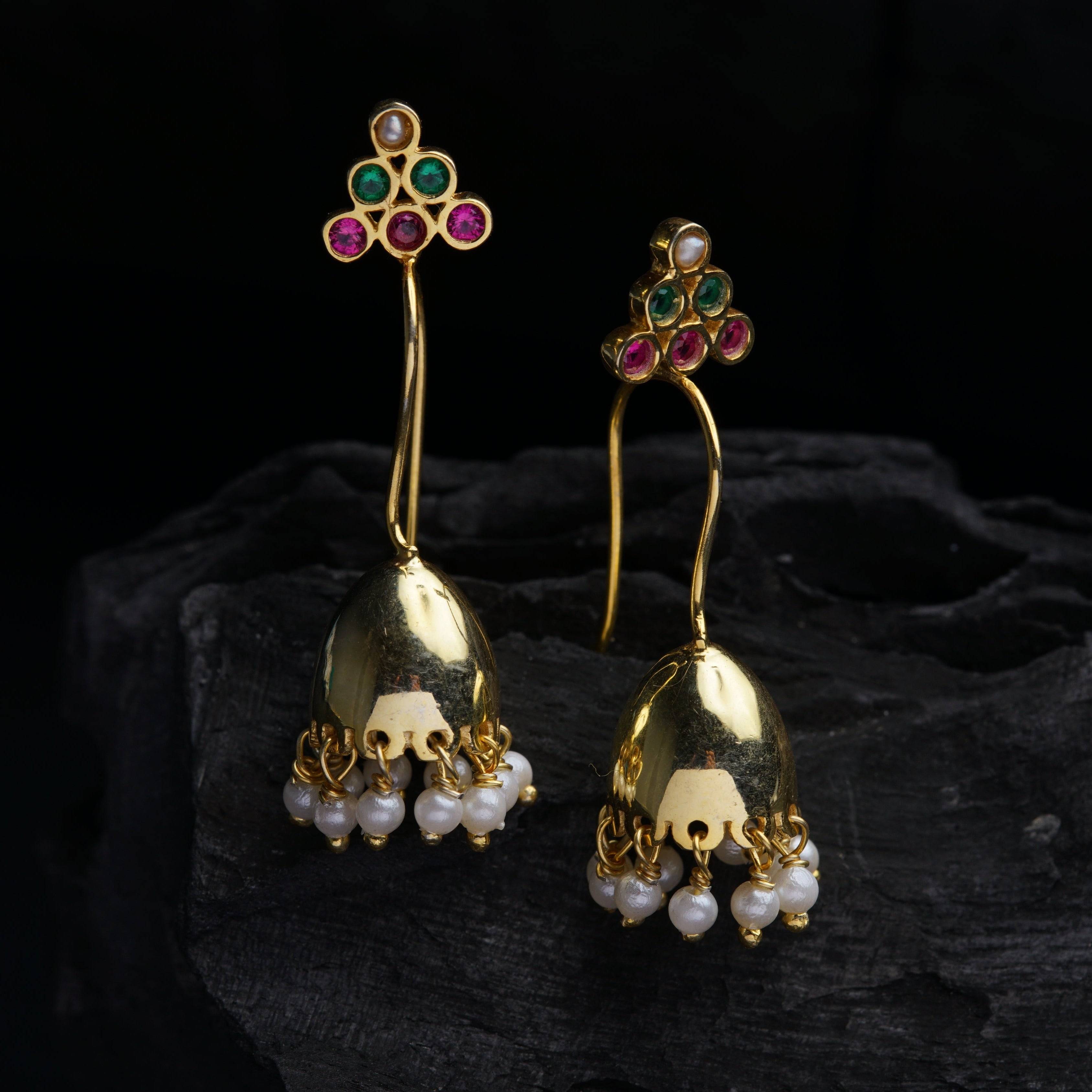 a pair of gold earrings with multi - colored stones