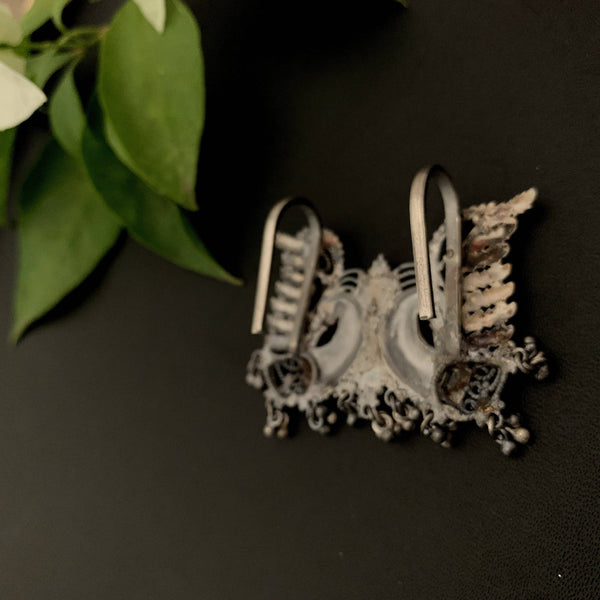 a close up of a hair brush and a flower