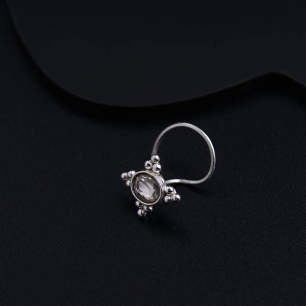 a close up of a ring on a black surface