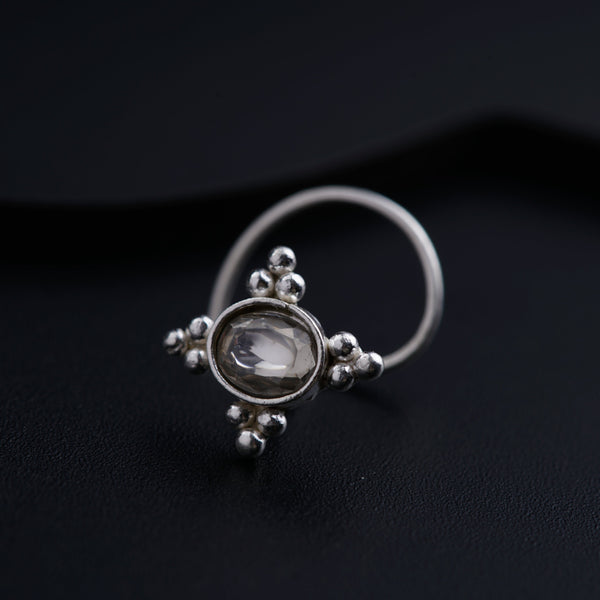 a close up of a ring on a black surface