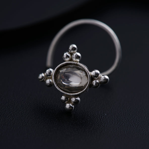 a close up of a ring on a black surface